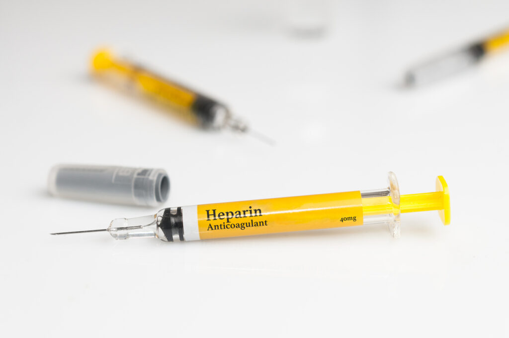 Pre filled heparin syringe on white table 